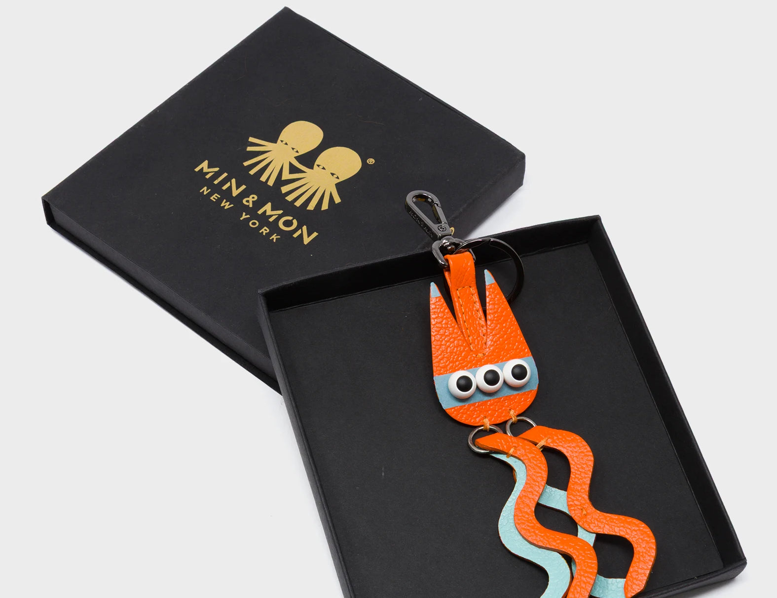 Cosmic Cat Charm - Vermillion and Eggshell Blue Leather Keychain - Package