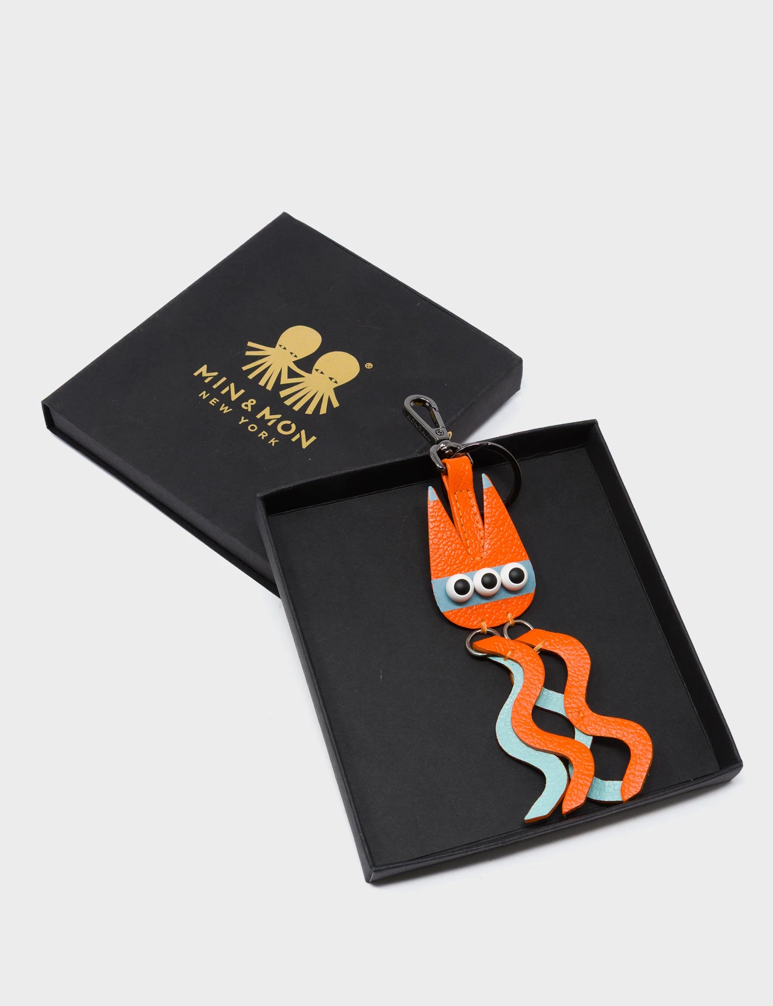 Cosmic Cat Charm - Vermillion and Eggshell Blue Leather Keychain - Package