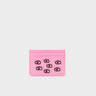 Pink cardholder with eye designs on a white background
