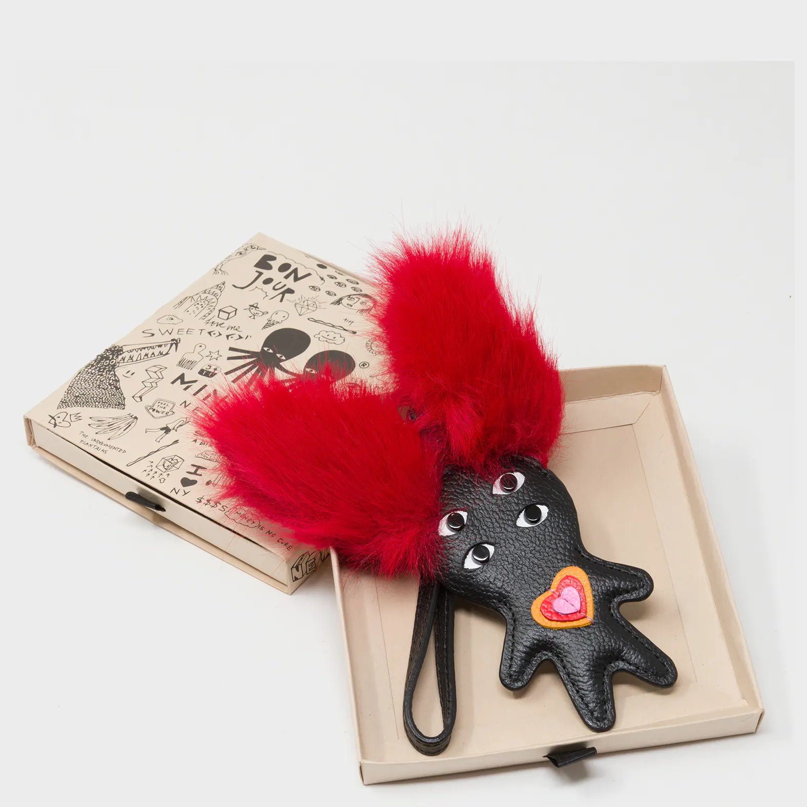 Fluffy Fella - Black and Red Leather Bag Charm - Box View