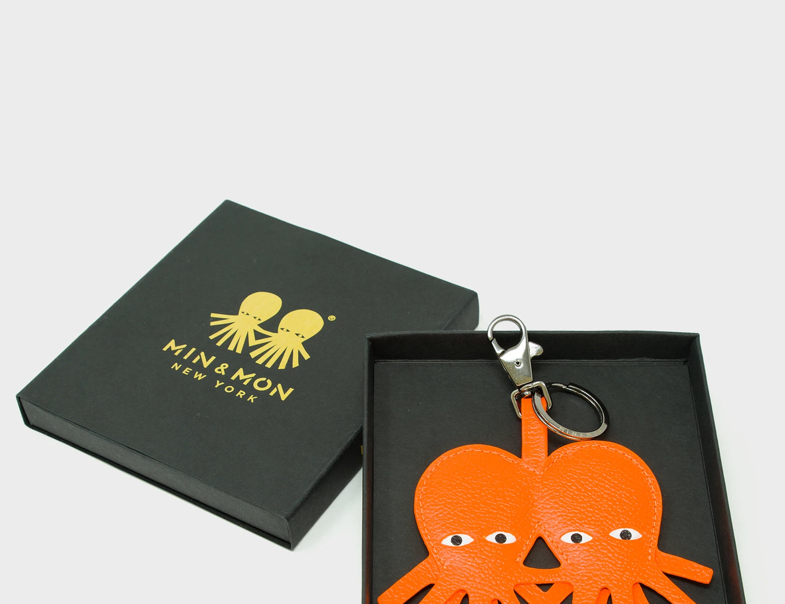 Octotwins Charm - Neon Orange Leather Keychain - Package