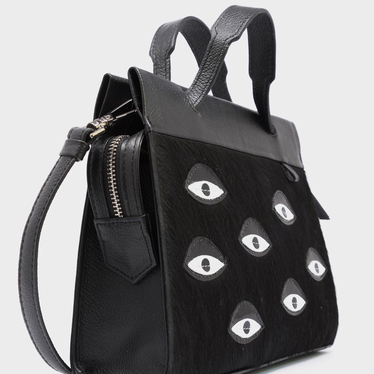 Vali Crossbody Small Black Leather Bag - Eyes Applique Adjustable Handle - Side Corner View