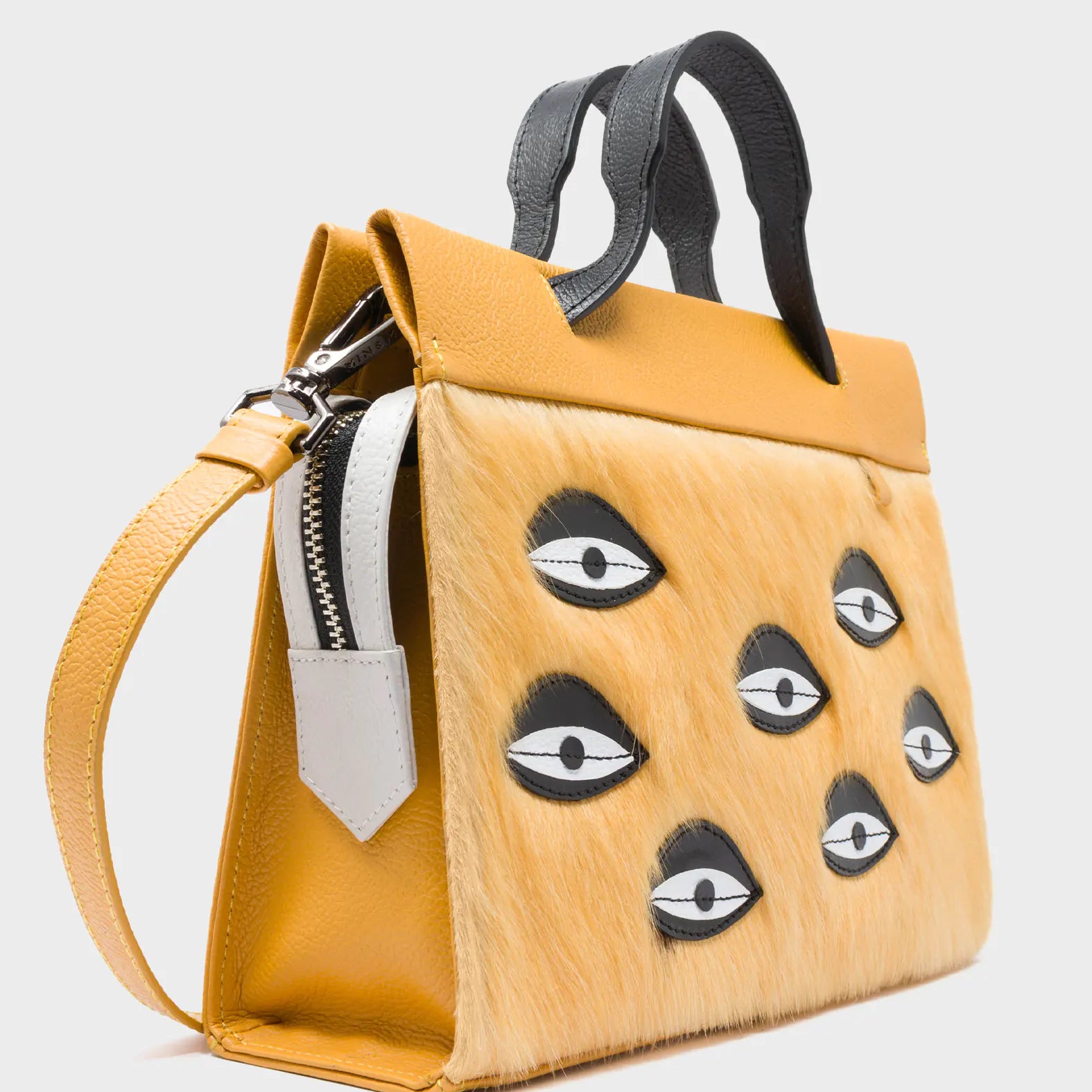 Vali Crossbody Small Golden And Black Leather Bag - Eyes Applique Adjustable Handle - Side Corner View