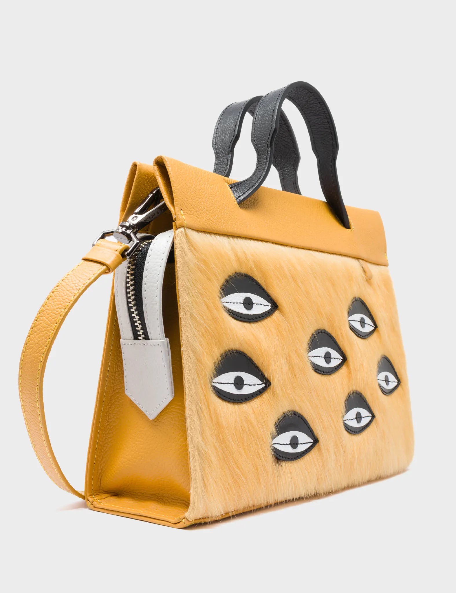 Vali Crossbody Small Golden And Black Leather Bag - Eyes Applique Adjustable Handle - Side Corner View