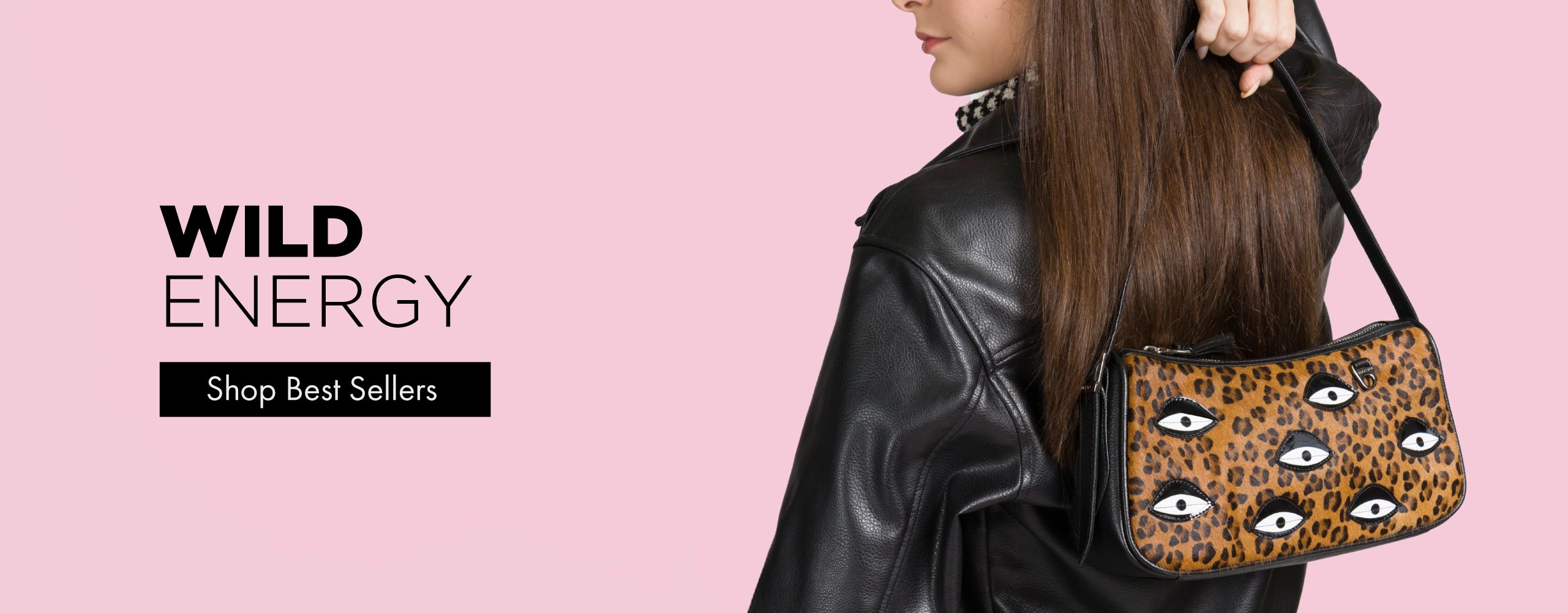 Woman wearing a black leather jacket carrying a leopard print Min & Mon shoulder bag with eye appliqués, text reads “Wild Energy” and “Shop Best Sellers.”