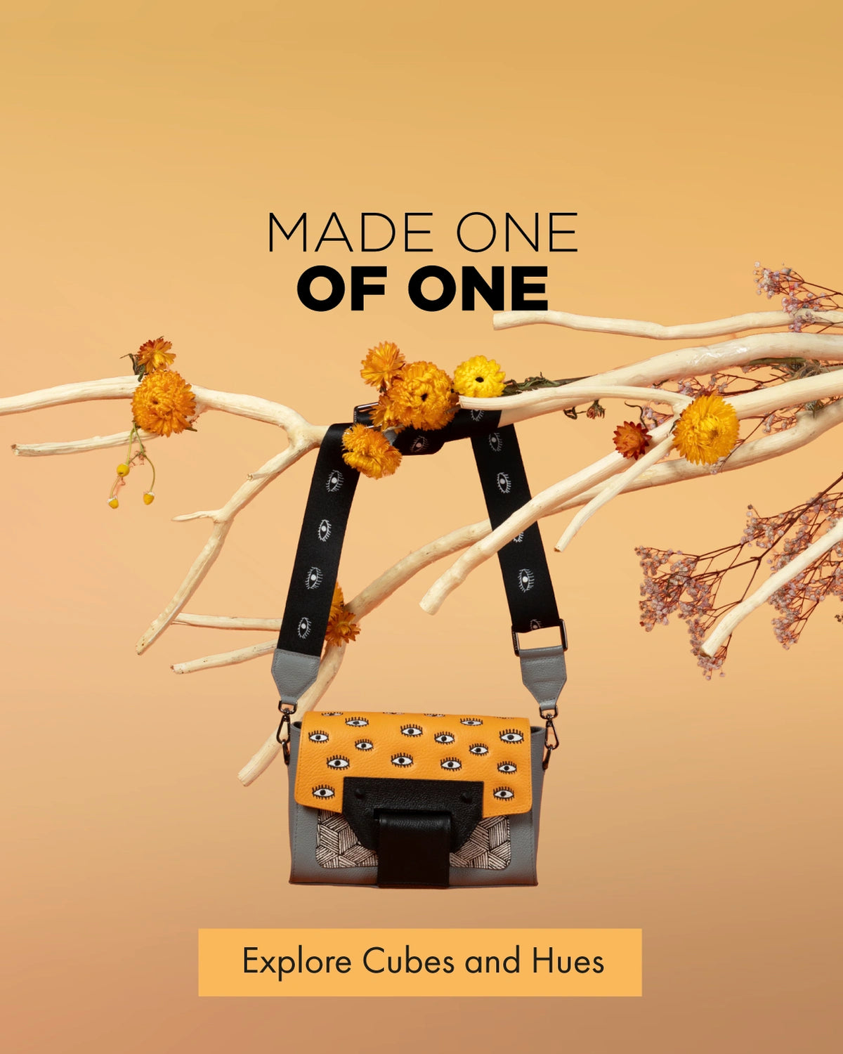 Min & Mon Cael crossbody bag from Cubes and Hues with orange eye-print leather, geometric details and black strap.
