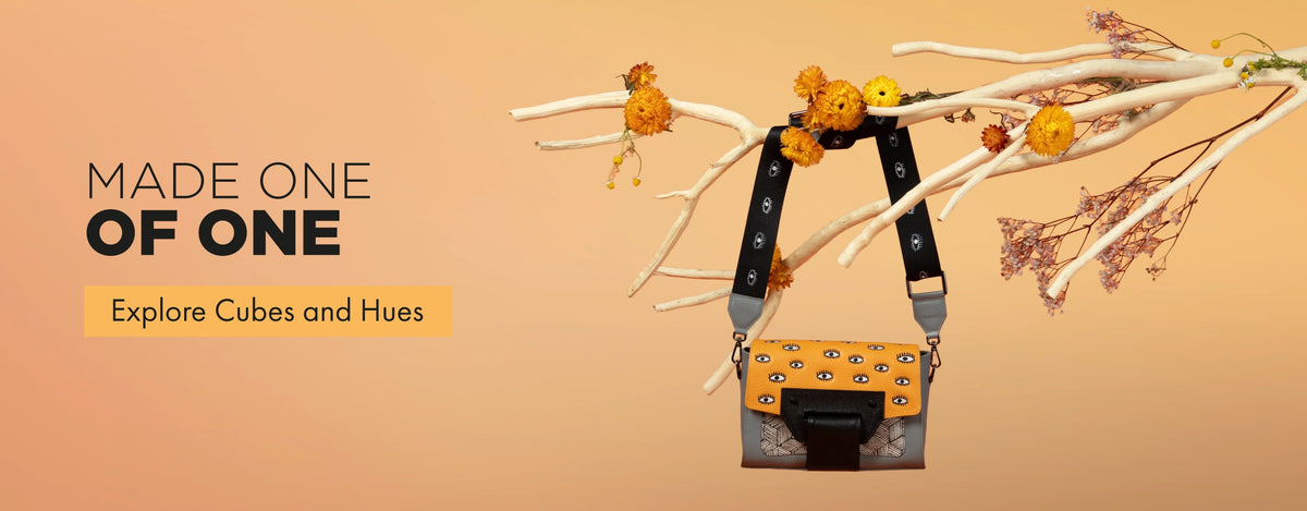 Min & Mon Cael crossbody bag from Cubes and Hues with orange eye-print leather, geometric details and black strap.