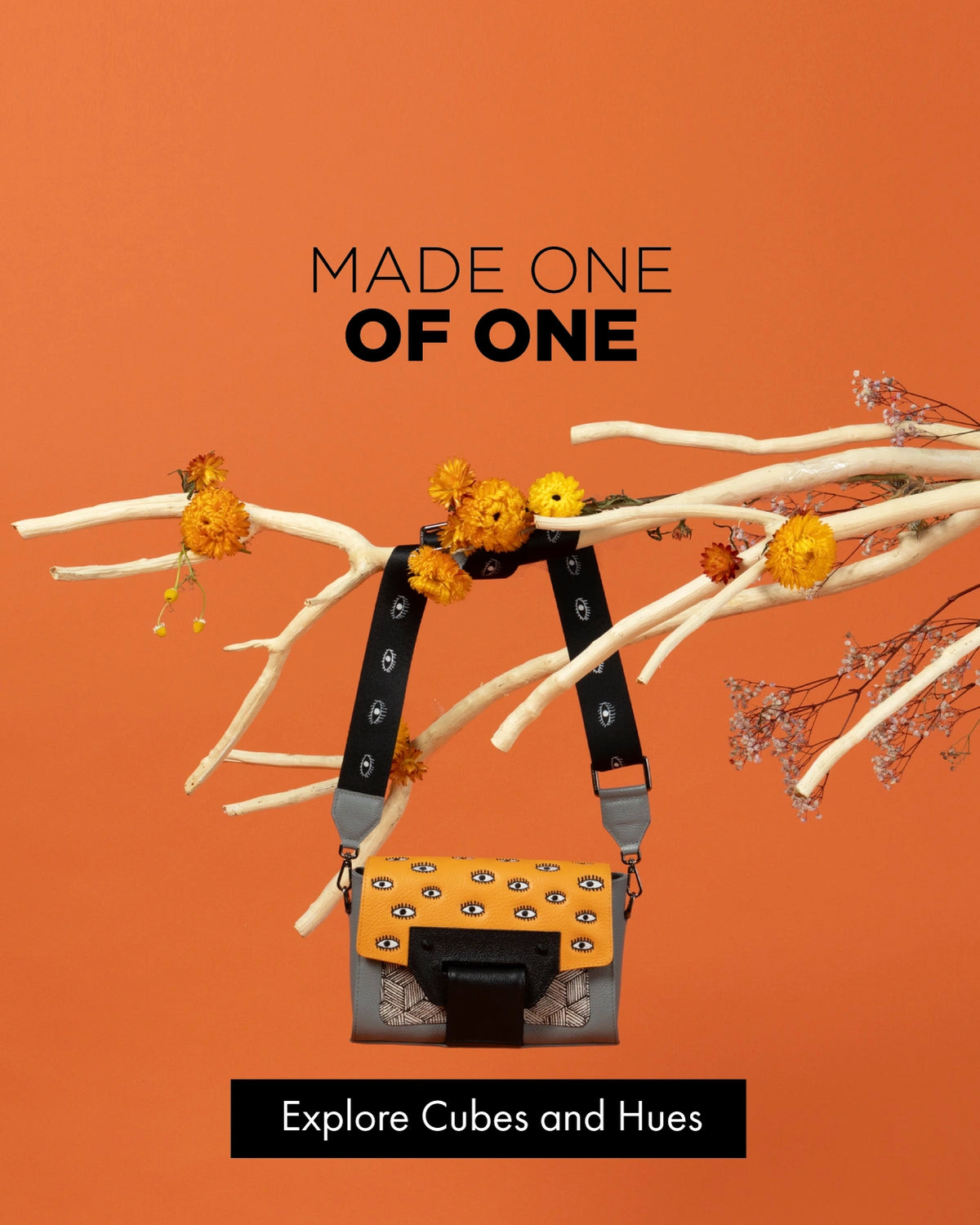 Min & Mon Cael crossbody bag with orange eye-print leather, geometric details and black strap.