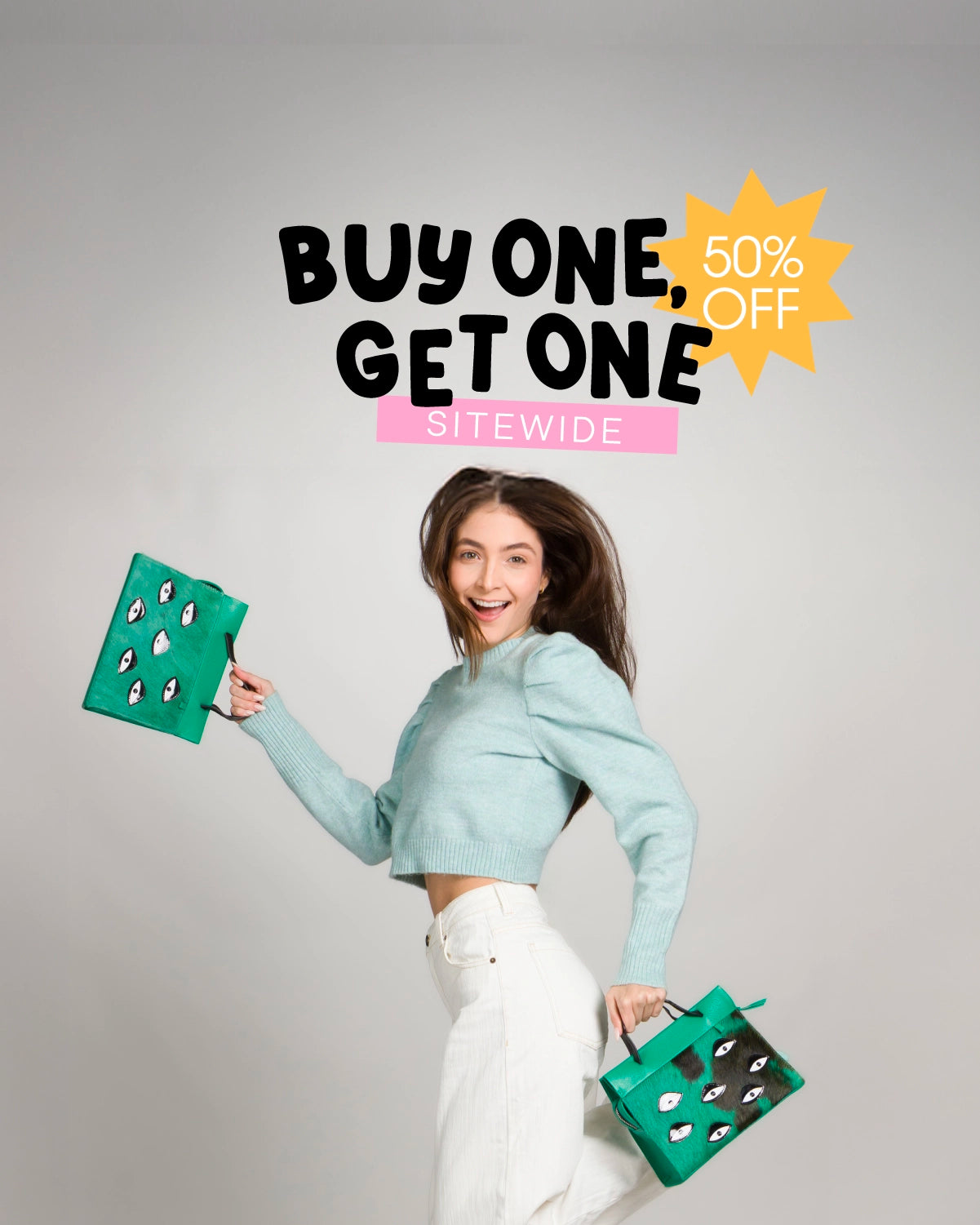 Min & Mon BOGO banner featuring a woman in a mint sweater and white pants holding two green handbags embroidered with playful eye motifs. Text reads: “Buy One, Get One 50% OFF sitewide.”
