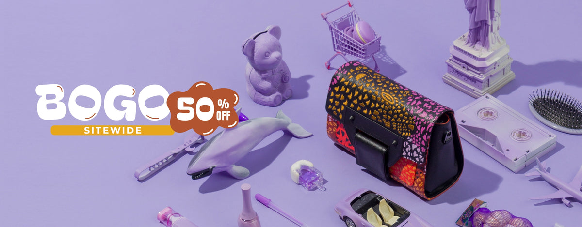 Min & Mon Cael handbag featuring a colorful animal-inspired print in pink, orange, and yellow, surrounded by playful purple accessories on a lilac 
Featuring a ‘BOGO 50% OFF Sitewide’ promotional graphic.