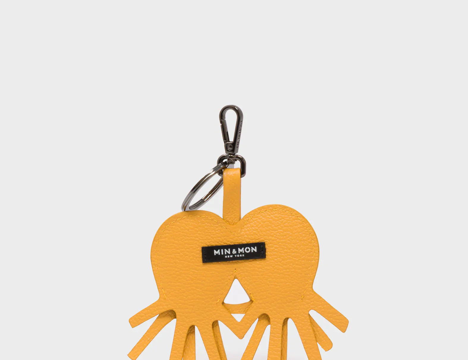Octotwins Charm - Golden Glow Leather Keychain - Back View