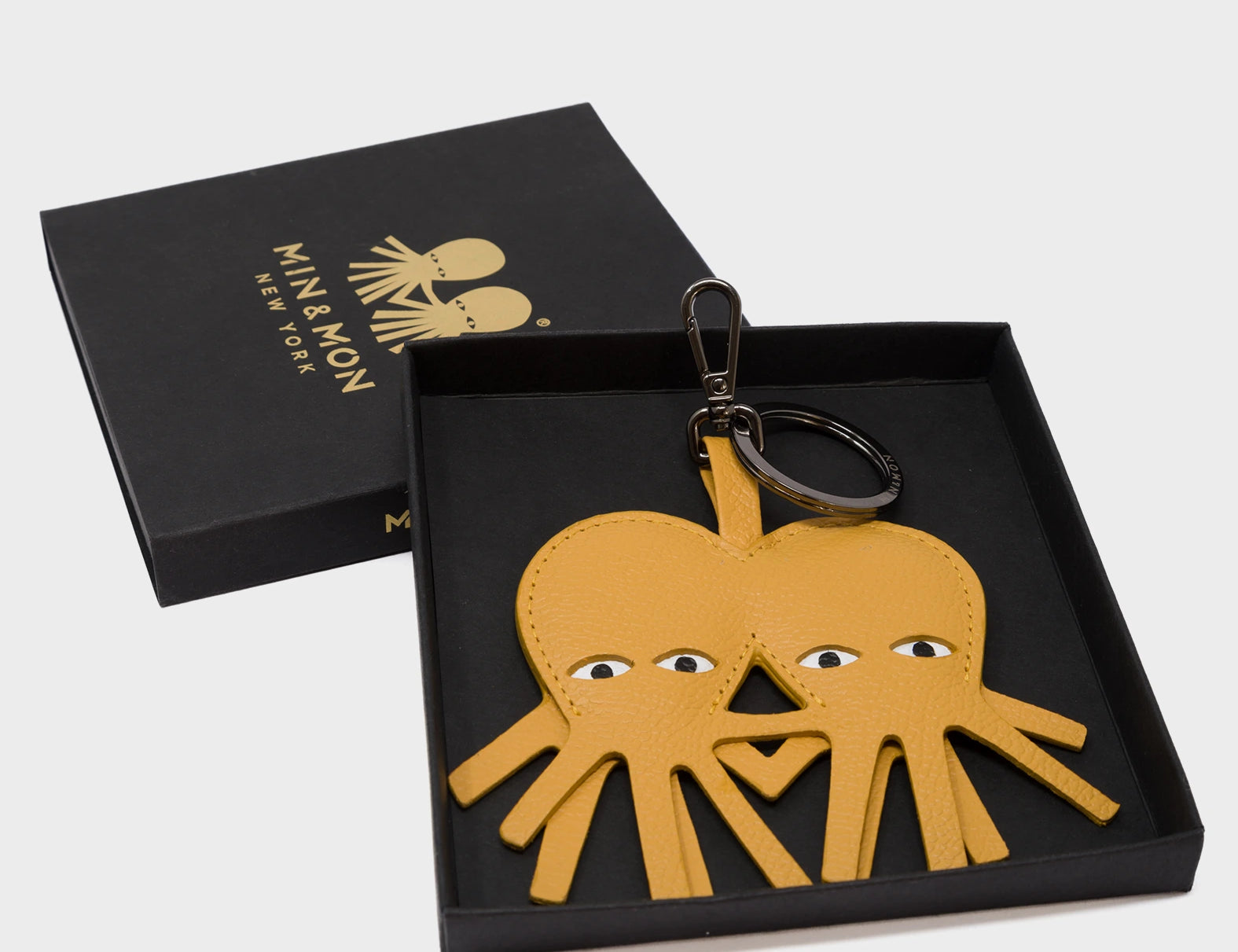 Octotwins Charm - Golden Glow Leather Keychain - Packaging View