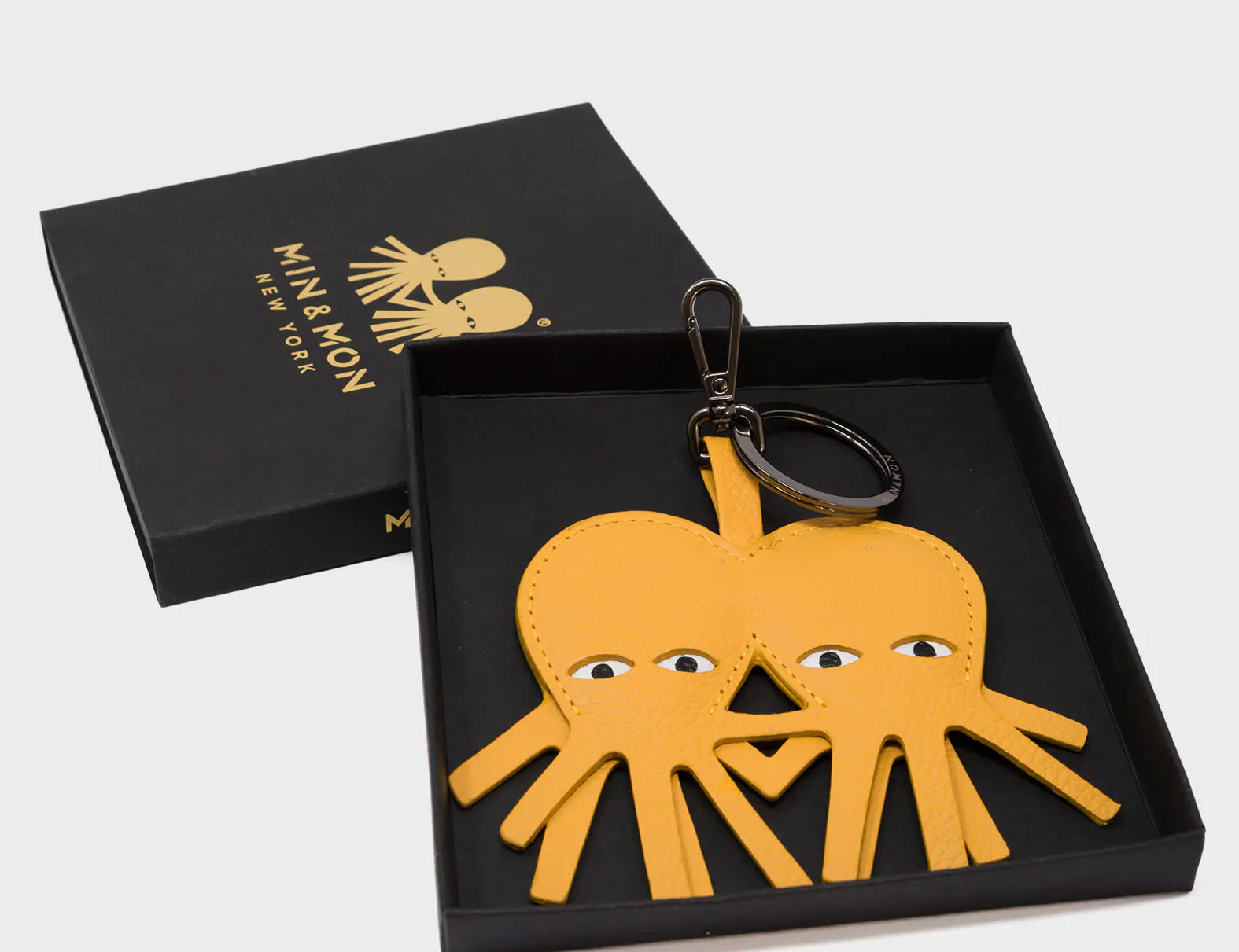 Octotwins Charm - Golden Glow Leather Keychain - Box View