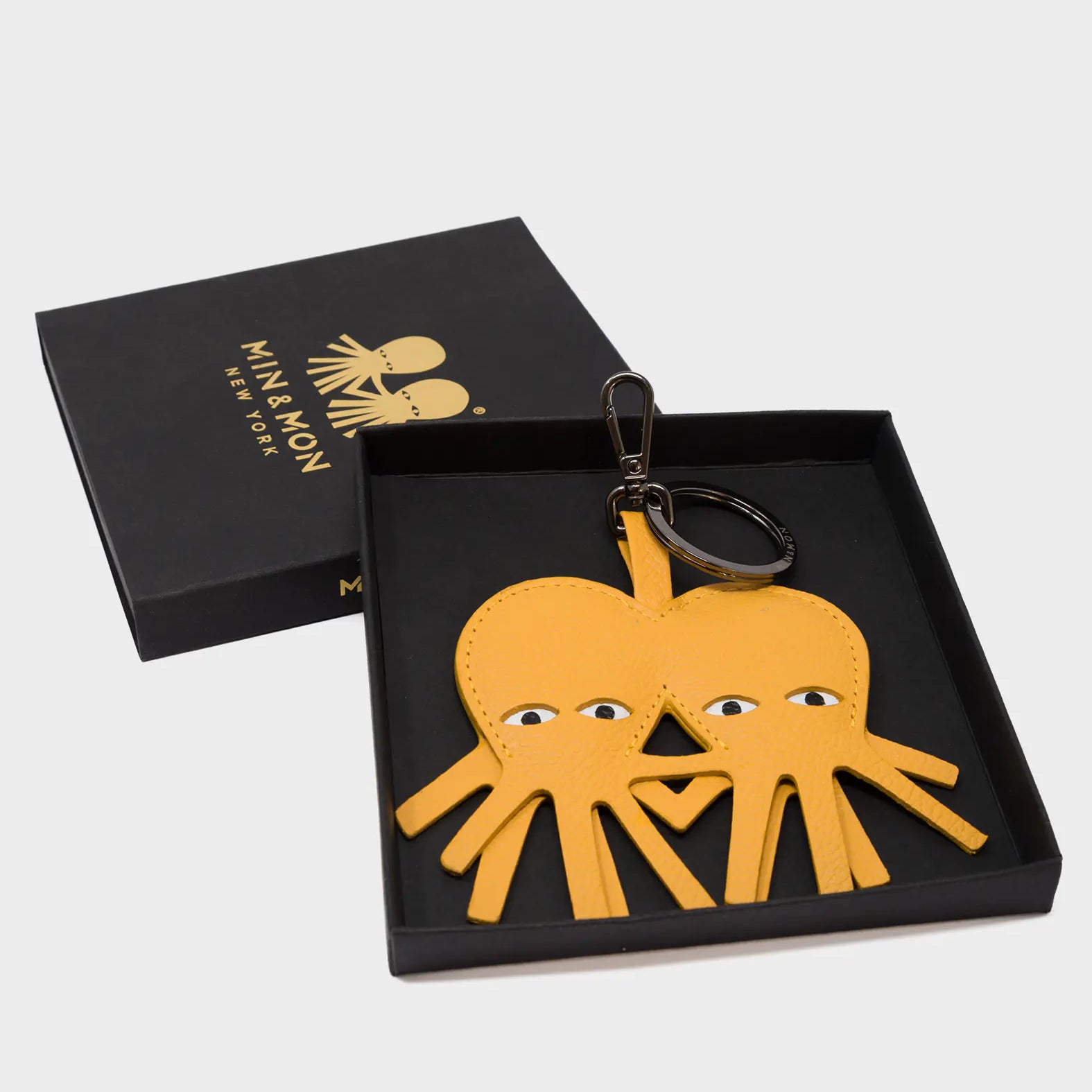 Octotwins Charm - Golden Glow Leather Keychain - Box View