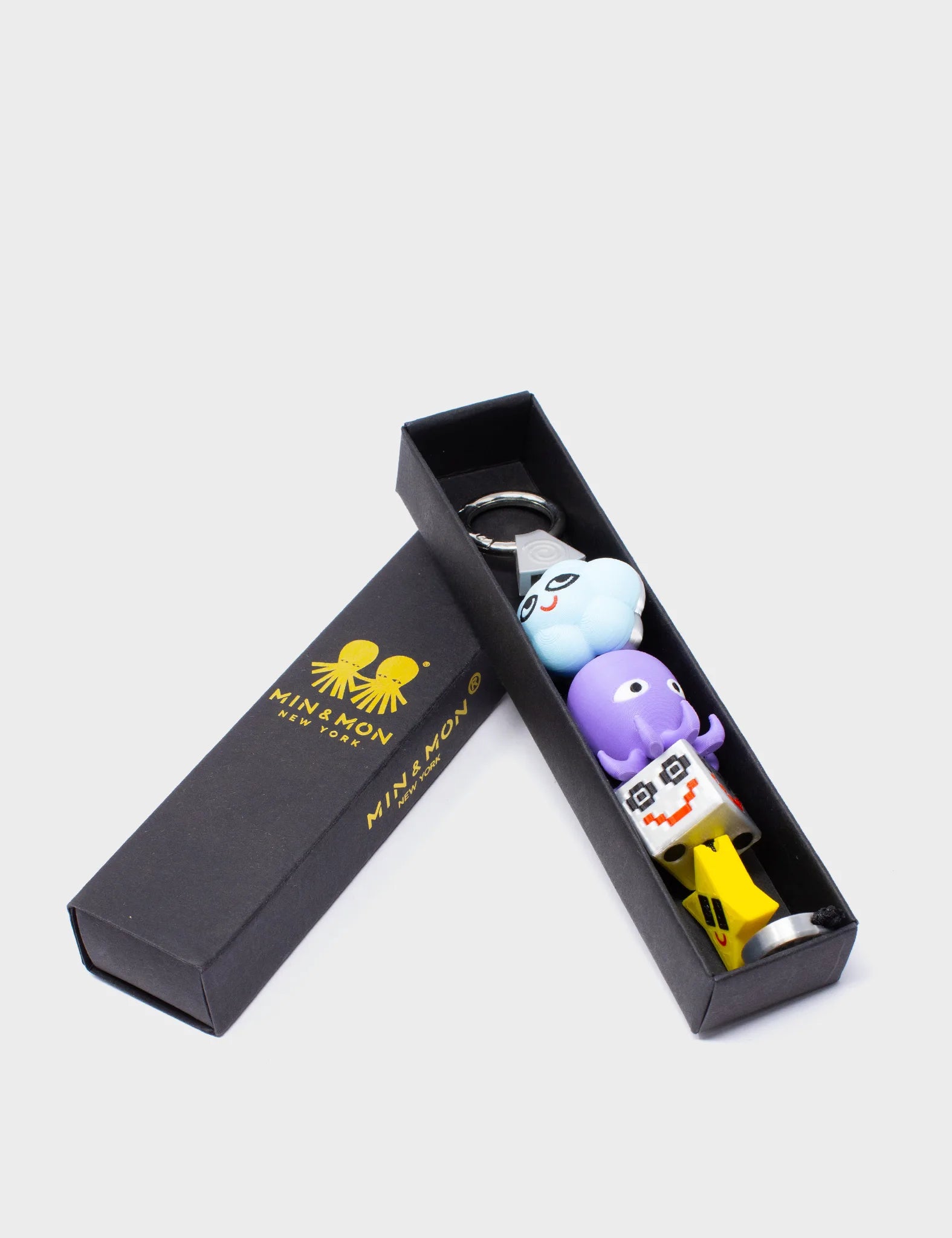 OctoDazzle Charm - Purple and Yellow Acrylic Keychain - Packaging View