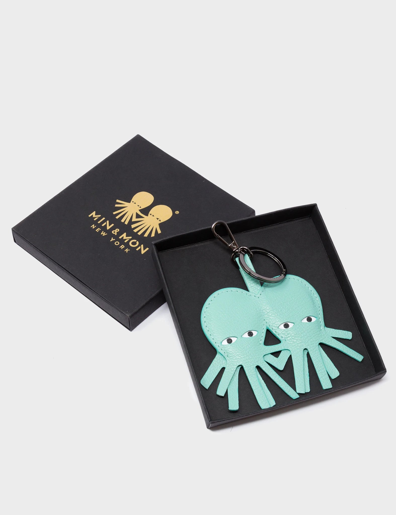 Octotwins Charm - Oceanic Green Leather Keychain - Packaging View