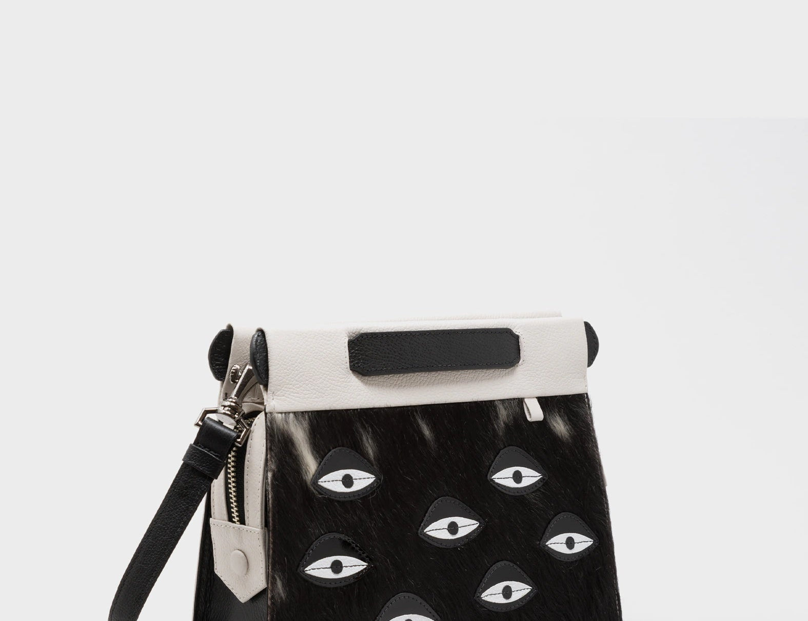 Vali Crossbody Small Cream Leather Bag - Eyes Applique Adjustable Handle - Front corner angle view