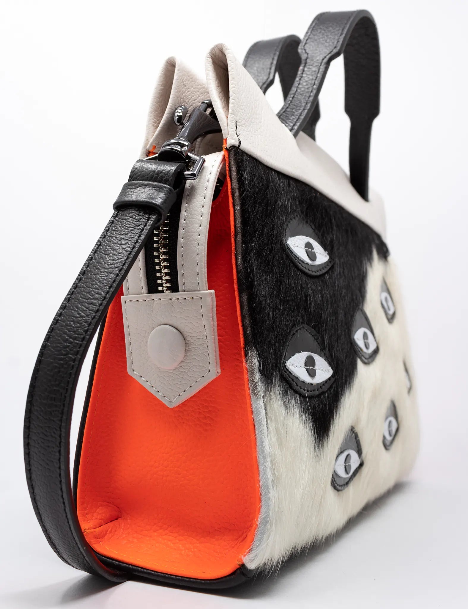 Vali Crossbody Small Black And Neon Orange Leather Bag - Eyes Applique Adjustable Handle - Side view