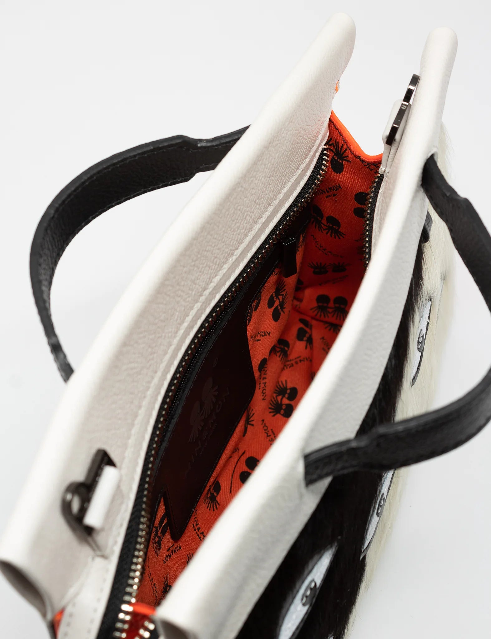 Vali Crossbody Small Black And Neon Orange Leather Bag - Eyes Applique Adjustable Handle - Inside view